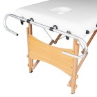 Massage table pad holder